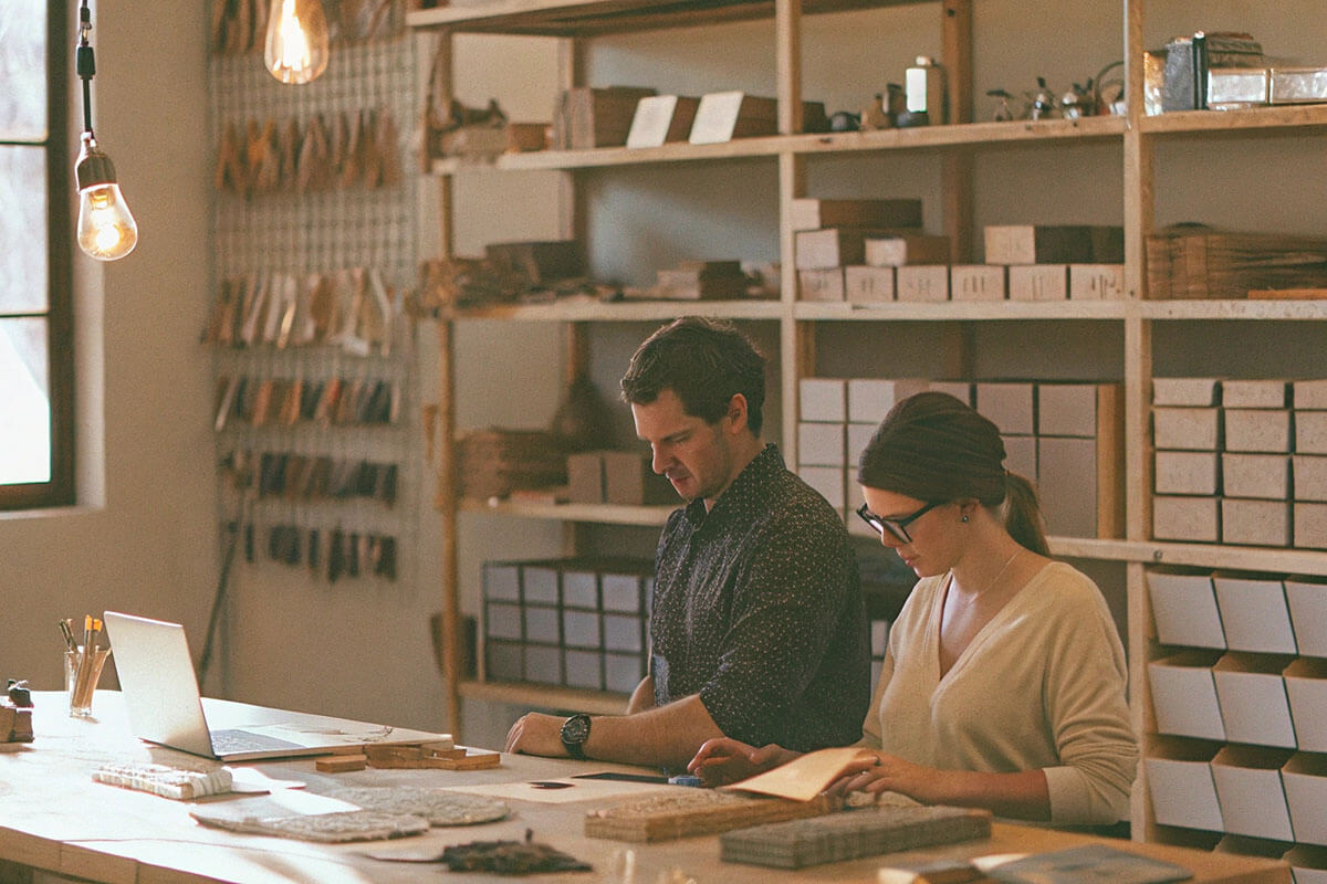 Organized workspace with small batch custom packaging products